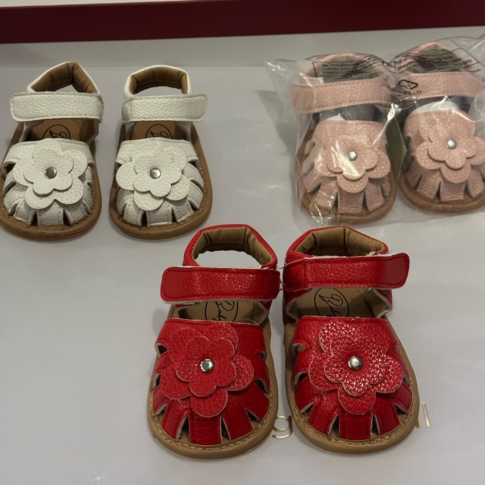 Three pair of size 3 baby soft walkers.